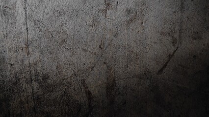Grungy old paper wall texture with vintage brown surface and rough aged stone backdrop.