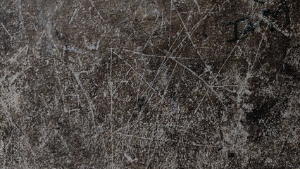 Dark, rough texture of an old stone wall with a grunge pattern and winter forest tree surface.