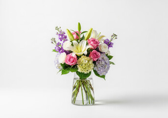 Beautiful bouquet of colorful fresh flowers in a clear glass vase