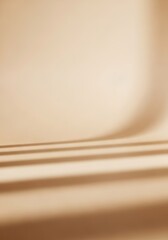 Subtle minimalist backdrop featuring soft beige hues and delicate shadow play for artistic display