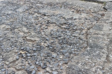 Concrete road damaged cracks and slaps texture background