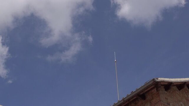 Lightning rod clouds sky building roof storm