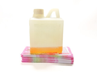 The Concept of Expensive Gasoline A Plastic Container Sitting On A Stack Of Banknotes Symbolizing High Fuel Costs