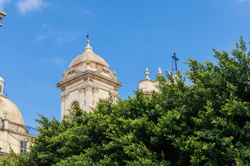 Catholic church facade under bright blue sky
