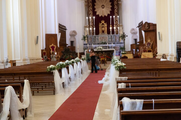 Empty catholic church interior prepared for wedding