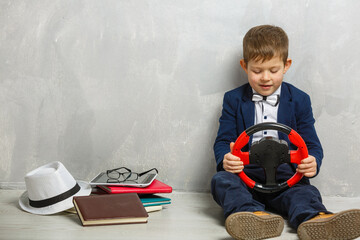 a small schoolboy with a wheel