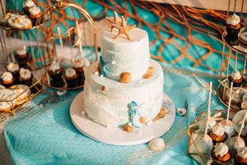 Beach Themed Celebration Cake with Ocean Decorations
