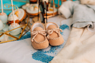Baby Boy Christening Shoes and Outfit Display
