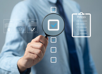 Businessman reviews company policies, digital documents, ideal for policy management, business compliance, document approval, and corporate governance visualization.
