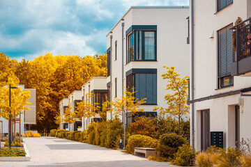 Residential Apartment Buildings in  Autumn. Modern Building Exterior with Fall Landscaping. 
