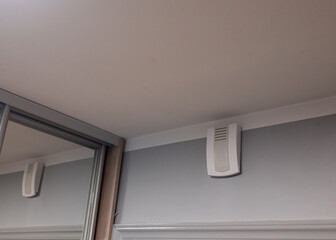 Rectangular apartment doorbell mounted outside the apartment, next to the entrance door. Classic design still commonly seen in older buildings and modern multi-story residences.