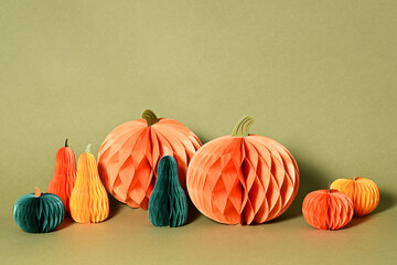 Autumnal composition of paper pumpkins