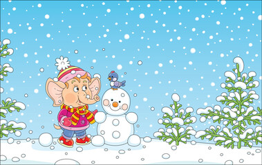 Cute little elephant playing with a merry small bird and making a funny toy snowman on a winter walk in a beautiful snowy park, vector cartoon illustration