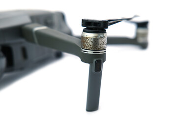 Close-up of Drone Propeller Motor with Rust and Corrosion on White Background