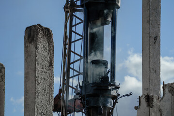 Pile driver install piles on the construction site at daytime