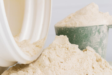 Protein Powder with Plastic Bottle on White Background Nutrition Photostock