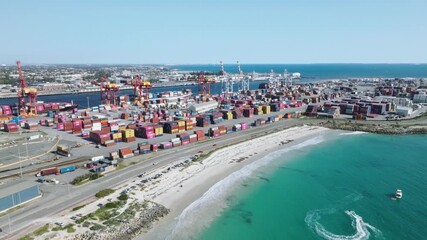 Aerial view of Fremantle Harbour, where the turquoise ocean meets the vibrant port with shipping containers, Fremantle, Western Australia, Australia. - Powered by Adobe