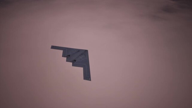 Stealth Bomber Flying At Sunset