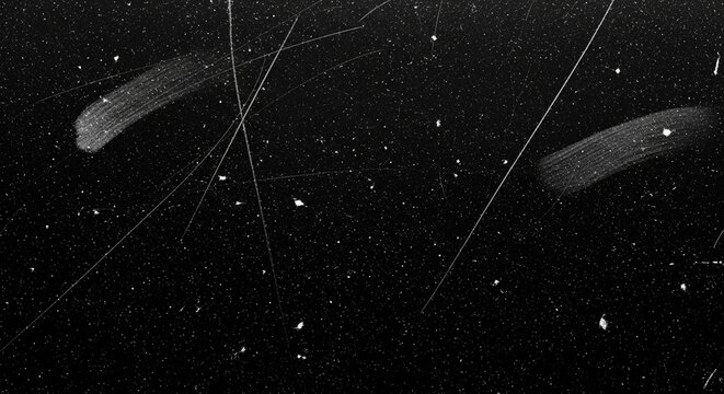 Black scratched surface with dust and noise creates a vintage effect