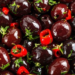 Close-up of dark olives, herbs, and chili flakes