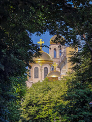 Naklejka premium Golden Domes of Orthodox Cathedral. Stunning Religious Architecture and Travel Landmark. Cathedral of the Assumption in Varna. Varna is the sea capital of Bulgaria.