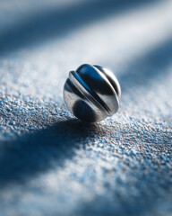 Dreidel spins gracefully in mid-air against a backdrop of soft shadows