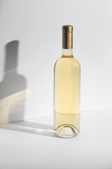 White Wine bottle mockup with golden cap, showcasing elegant design and smooth glass texture, ideal for branding and marketing concepts with copy space