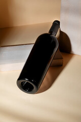 Elegant Red wine bottle mockup positioned on a minimalist surface with soft lighting, showcasing sleek design and modern aesthetics for creative branding concepts