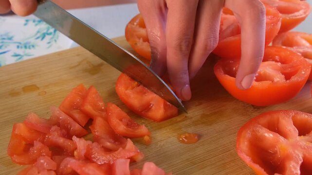 Chef woman hands cooking cutting deseeded red tomatoes on wooden board on kitchen. Culinary skills techniques, homemade prepare healthy meal, cook domestic food vegetable, cuisine, fresh ingredient.