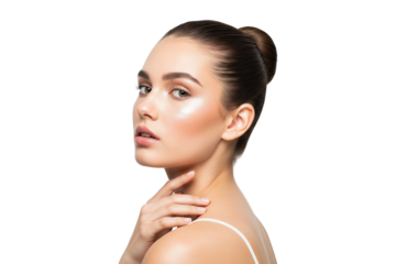 Beauty portrait of a young woman with glowing skin and a bun hairstyle