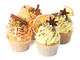 Delicious cupcakes with sprinkles, cookies, nuts and spices isolated on white. Autumn atmosphere