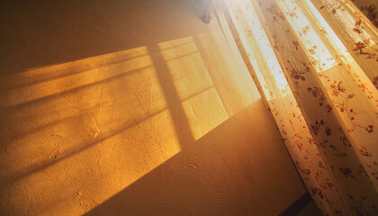 Golden sunlight comes through a curtain and lights up a textured wall and soft bedsheets.