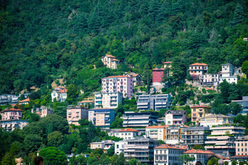 Fototapeta premium Panorama of the shores of Lake Como with villas and mountains in Italy. Cinematic photography. An ideal image for tourism, luxury, real estate, travel and nature themes.