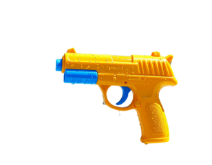 A vibrant yellow water gun toy shooting a stream of blue water droplets, perfect for summer fun and outdoor play.