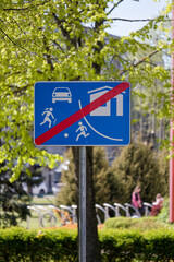 European Blue Rectangular End of Residential Zone Sign with House, Car and Children Crossed Out