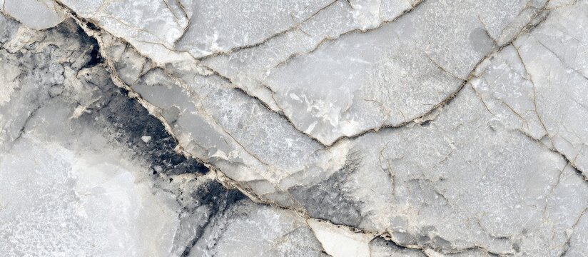 Stone slab with grey and white tones, marked with golden veins and cracks