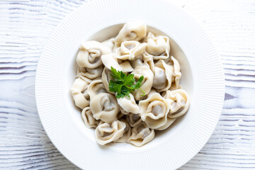 Close-Up of Pelmeni Dumplings on a White Plate
