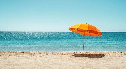 Orange beach umbrella on sandy shore (1)