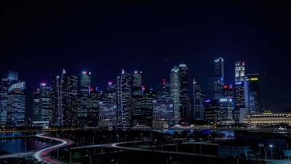 Fototapeta premium Singapores Dazzling Skyline at Night - A Modern Metropolis.