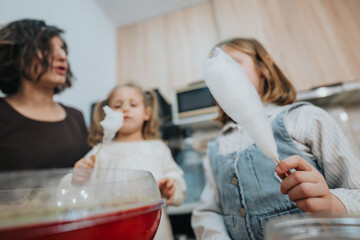 A heartwarming scene where a mother and her daughters prepare and savor cotton candy at home.