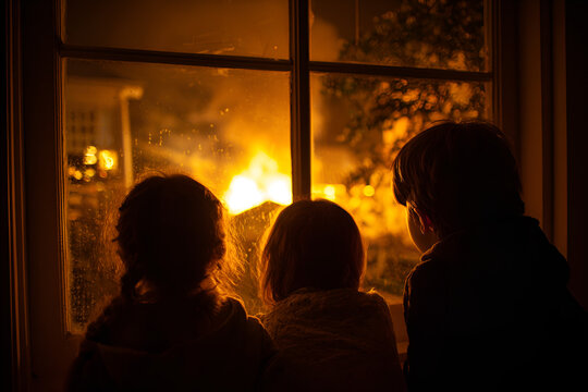 Children watching bonfire window Guy Fawkes celebration