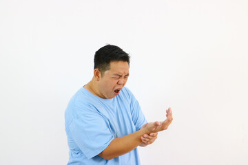 Man with very bad wist pain on isolated white background