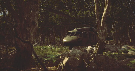 A military helicopter hovers low over lush green foliage, surrounded by towering trees, as sunlight filters through the leaves, casting golden hues on the forest floor.