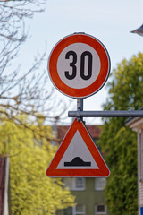 European Speed Limit 30 Sign with Triangular Road Bump Warning