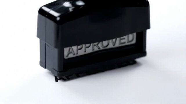 Official black rubber stamp with bold APPROVED message.