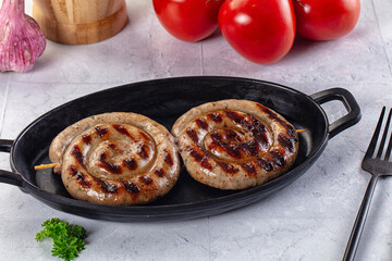 Grilled beef round circle sausages