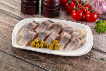 Slided marinated salted herring fillet
