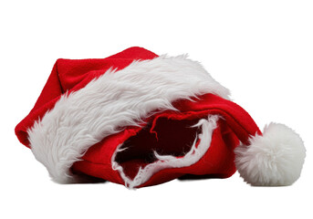 A macro view of a torn crimson Santa hat, revealing intricate fabric, with soft white faux fur trim and pom-pom, isolated on a transparent background. Concept of festive deconstruction
