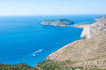 Aerial View of the Forested Assos Peninsula and Rugged Northern Coastline Against the Deep Blue Ionian Sea, Kefalonia, Greece