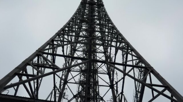Massive Steel Lattice Tower Structure Against Grey Overcast Sky